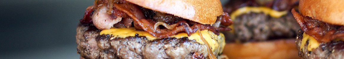 Eating Burger at Shuttle Burgers restaurant in Houston, TX.